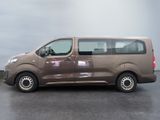 a brown van that is parked in a parking lot
