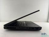the back of a laptop computer sitting on top of a white table
