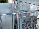 a pile of concrete blocks sitting outside of a gate