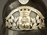 a close up of a helmet with a crest on it