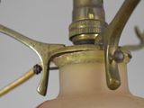 a close up of a bottle of liquid with a hose attached to it