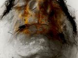 an old photograph of a man ' s face with hair on it