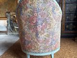 a chair that is sitting on the carpet in the room