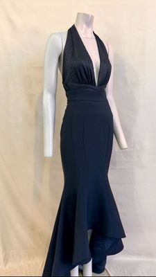 the mannequin is wearing a black dress with a deep v neckline