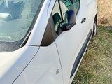 a white van that is parked in the grass