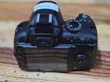 a small camera sitting on a wooden table