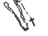 black and white beaded rosary with a cross on a chain