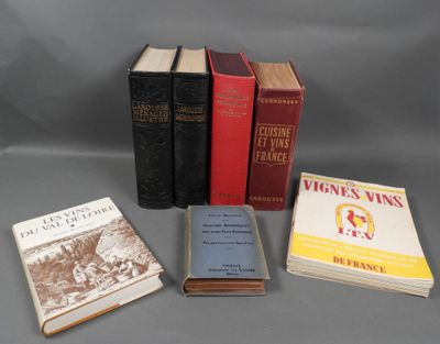 several books are stacked on top of each other on a table