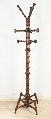 a wooden coat stand with a coat rack on it