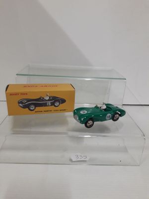 an image of a green toy car and a box on a table