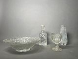 a glass bowl and a glass vase on a table