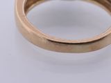 an image of a gold ring with a diamond