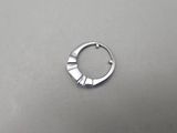 a close up of a metal ring on a table