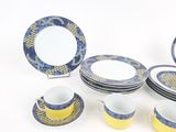 a lot of plates and cups that are sitting on a table