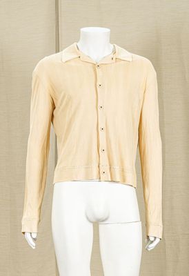 mannequin dressed mannequin wearing a yellow shirt and white pants