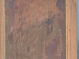 an image of a painting on a wooden frame on a table