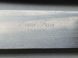 a close up of a pair of knives on a table
