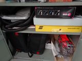 a box of tools on a shelf in a room