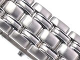an image of a close up of a watch bracelet on a white surface