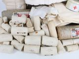 a pile of toilet paper and toilet paper rolls on the floor