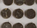 many different types of ornaments hanging on the wall