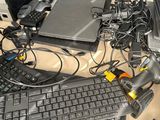 a lot of computer equipment that are on the table