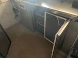 an image of a kitchen with a sink and a refrigerator