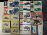 a lot of old model cars on display on a table