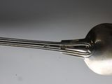 a silver spoon with a spoon handle on it
