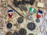 a picture of a collection of medals and other items on a table