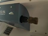 a close up of a machine with a duster on it