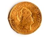 une vieille pièce d'or sur laquelle est représentée la tête d'une femme