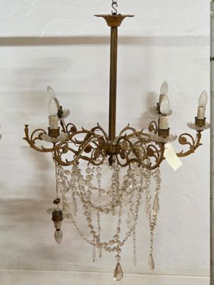 a chandelier hanging from the ceiling in a room