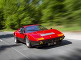 a blurry photo of a red sports car driving down the road