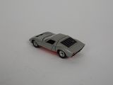 a toy car that is sitting on a white surface