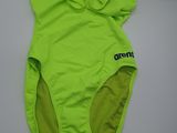 a green swimsuit with a hood on it sitting on a white surface