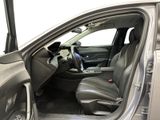 the interior of a car with the door open and the driver ' s seat down