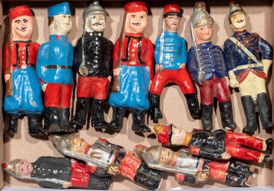 many toy soldiers in a box on the table