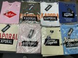 a lot of t - shirts that are on a table
