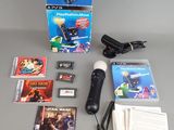 nintendo wii game system with accessories including a microphone, game cards, and a charger