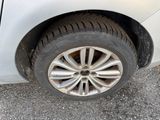 a white car that has a flat tire on it