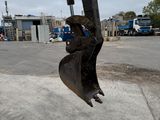 an image of a large excavator in a parking lot