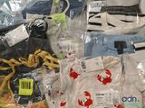 a lot of clothes that are in a plastic bag