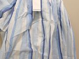 a blue and white striped shirt hanging on a hanger