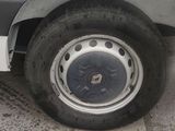 a white van that has a flat tire on it