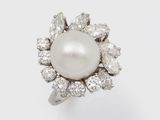 une bague en perles et diamants