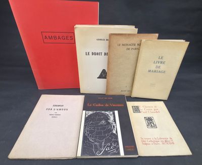 several books are lined up on a table with a black background