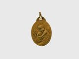 a gold coin with a woman holding a flower on it