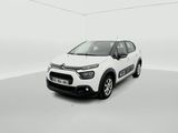 a white citrole is parked in a white room