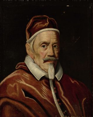 portrait d'un homme vêtu d'une robe rouge, à la barbe blanche et coiffé d'un bonnet rouge